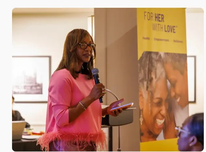 Dr. Sheppard speaking at the inaugural For HER with LOVE event